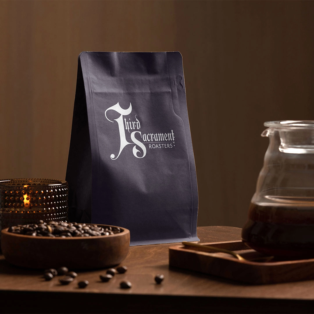 a coffee bag with blackletter art for Third Sacrament coffee