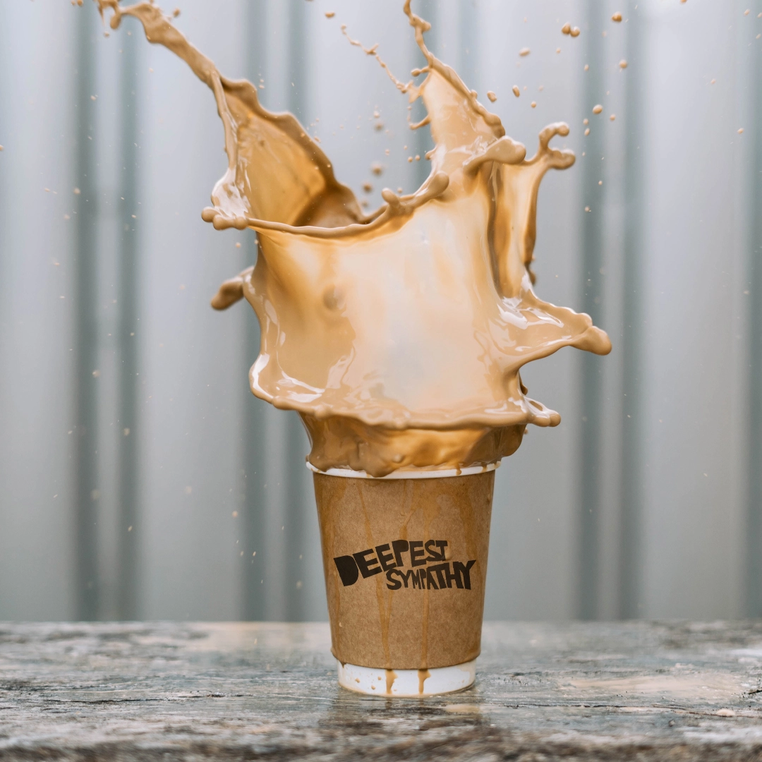 coffee splashing out of a cup with the words deepest sympathy