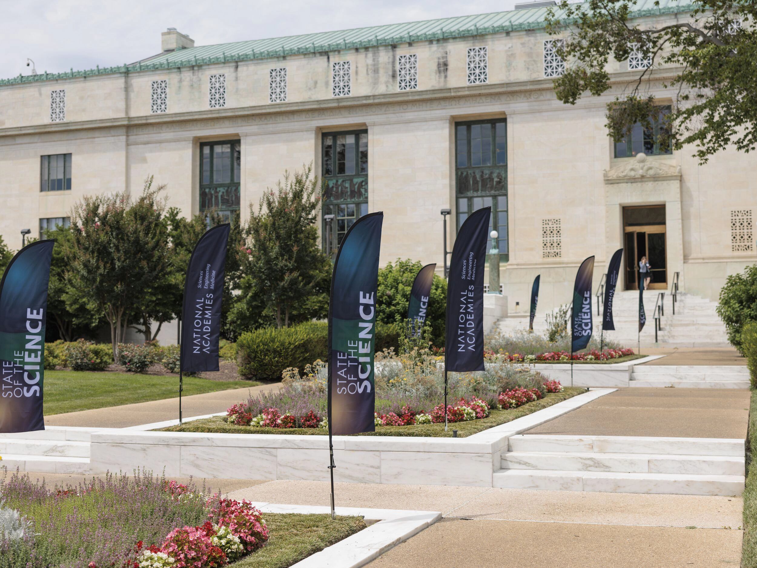 State of the Science event flags lining the walkway of the National Academy of Sciences building